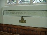 Inscription and brass
