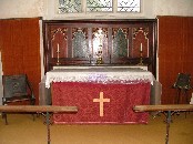 altar: the reredos appears to contain medieval panels