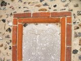 17th century memorial reset in external wall