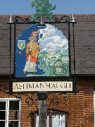 St Swithin on the village sign