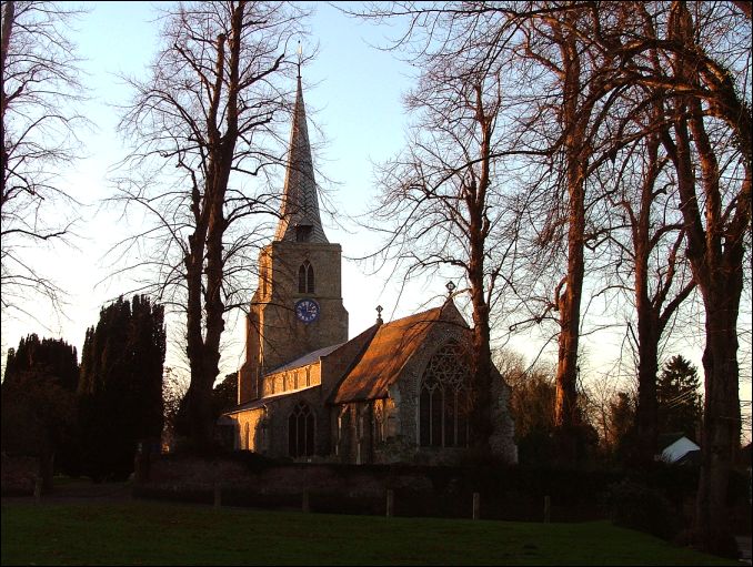 Banham: spire lifting to heaven beside the village green