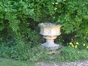 font in the garden of an adjacent cottage