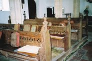 Medieval benches with pierced tracery in the back
