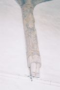 Figure in a wall post
