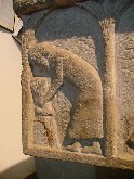 VIII: August. Binding a sheaf of corn