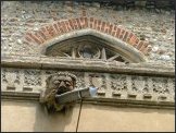 Gargoyle and clerestory window