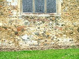 former entry to vault in east wall of chancel