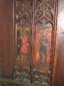 St Agnes, with a dagger and a little lamb, and St Dorothy, with a basket of flowers