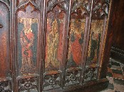 St Zita with her household keys, St Barbara with a tower, St Edmund in royal robes and carrying an arrow, and St Edward the Confessor in royal robes carrying a ring