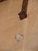 a puzzle: stone corbel below the tie beam angel