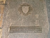 inscription and shield