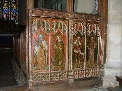 south side: St Paul with his sword and book, St Margaret killing a dragon, St Michael weighing souls, and St Barbara holding a tower