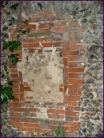 Bricked up to form a mausoleum, but the tablet has fallen