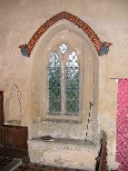Herbert Green's text surmounts the sedilia window