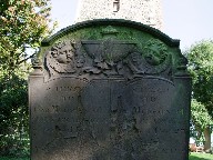 draped urn with cherubs