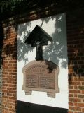 War memorial - unusually, set in a wall opposite the church
