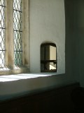 Chancel: squint from the south aisle chapel