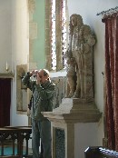 Clement Spelman looks on as Tom photographs the parents
