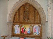 reredos in south aisle, restored by the Gurney family