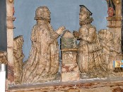 Robert Suckling and wife facing each other over a prayer desk