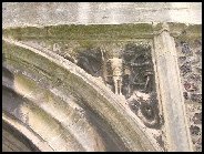 west door spandril: the martyrdom of St Edmund