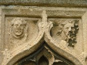 faces on a porch niche canopy