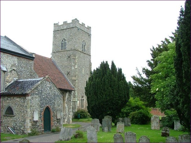 The tower of Reepham. The porch in the foreground is to Whitewell church, the red roof Whitwell's chancel