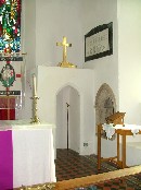 In the south-east corner of the chancel is a very curious structure, a little room built into the sanctuary