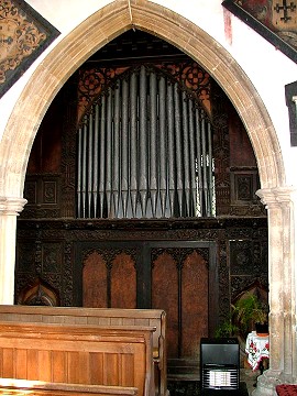 Scottow: unique organ case, built for (or by) the squire, Sir Henry Durrant 1859, incorporating old carving including what appears to be a Jacobean fireplace. 