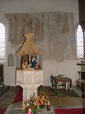 The font from the south, wall-paintings beyond.