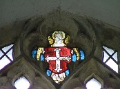 fragment of medieval glass high in a north nave window