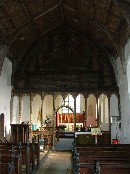 across the church, wall to wall and from the top of the roodscreen to the roof