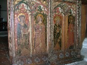 rood screen south: St Petronella with her book and keys, St Cecilia with her garland of flowers, St Barbara with her tower, and St Jeron with his hawk