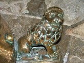 grinning lion on the lectern base
