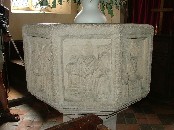 NE: Ordination, the Bishop with his back to us, and the ordinand kneeling facing us