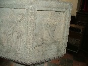 N: Mass, the Priest elevating the host behind a small stone altar