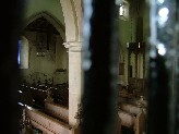through the little barred window