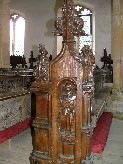 St Jude holds a boat in the niche; the sin above is Anger