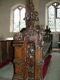St Peter holds a key in the niche; the sin above is destroyed