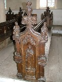 St Mary of Magdala surmounted by two figures in Tudor dress